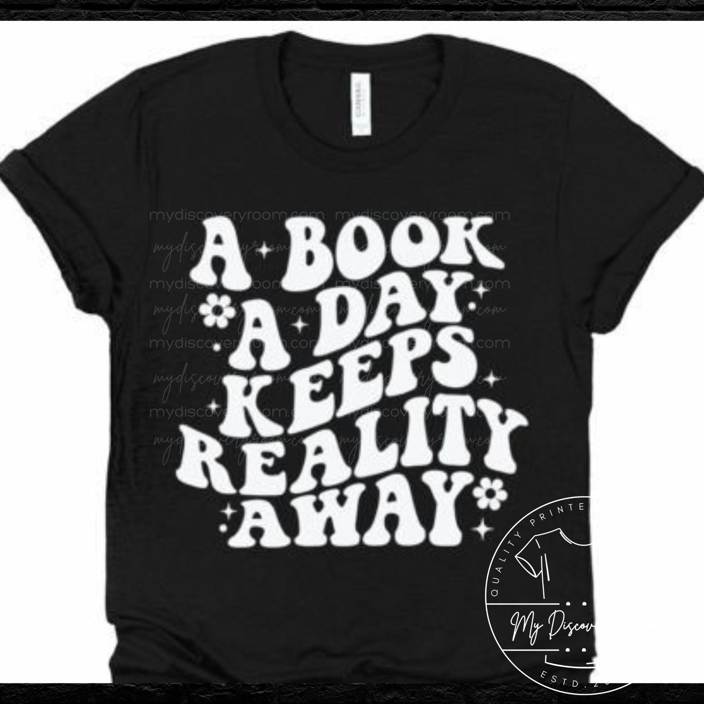 A Book A Day Keeps Reality Away Graphic Tee